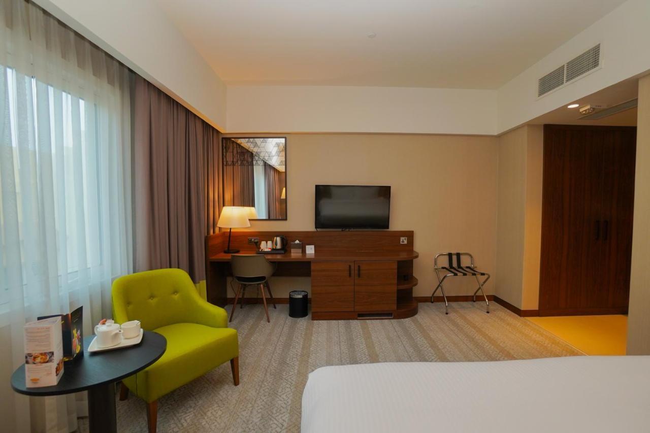 The Grand Lux Hotel Doha Exterior foto A room at the hotel
