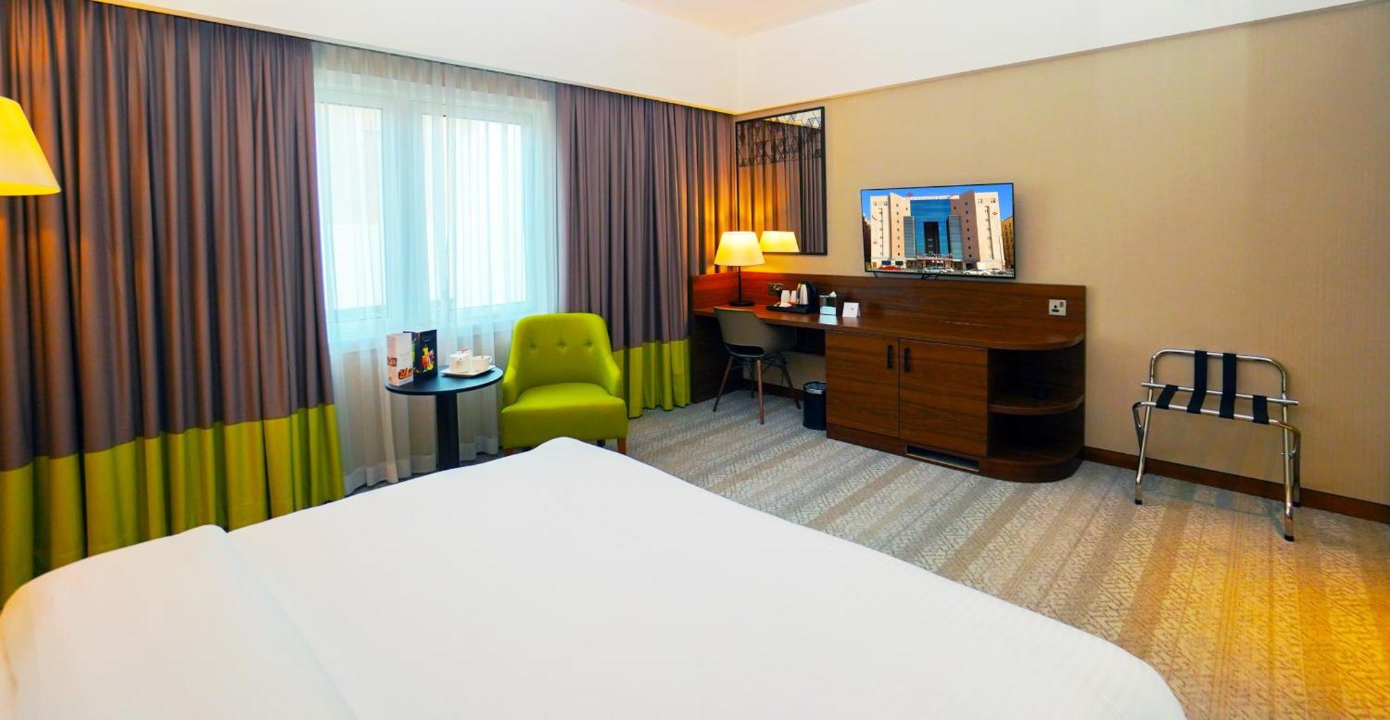The Grand Lux Hotel Doha Exterior foto A room at the hotel